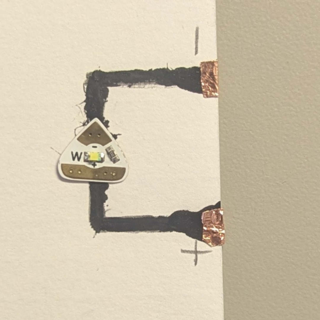 So I added copper to the sides of the paper, but even that didn't work. Unfortunately, all I can say is that these LED stickers are very picky and hard to impress in order to make them turn on by themselves.